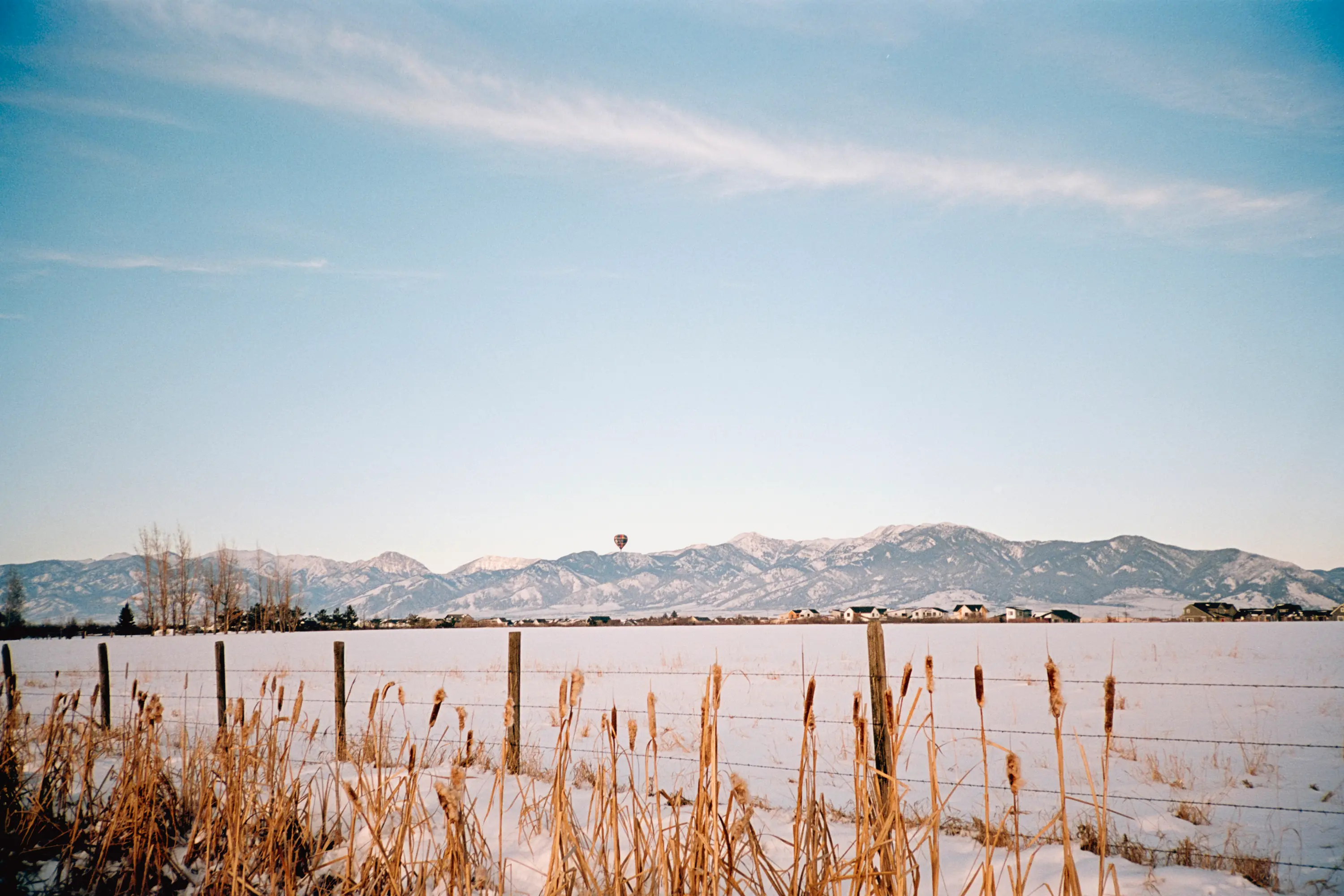 A hot air balloon touching the horizon in Bozeman