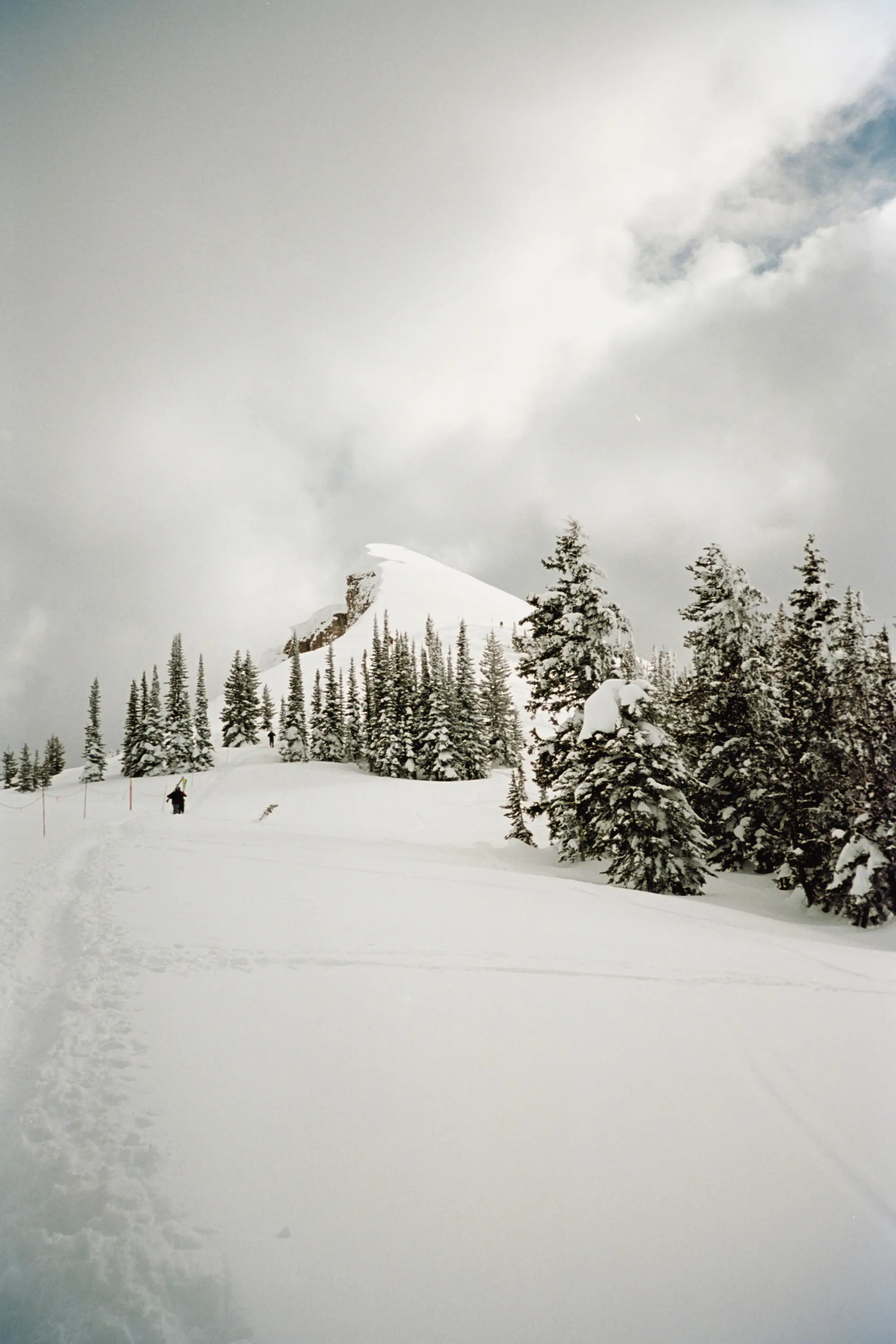 A couple skiiers hiking up Mary's Nipple